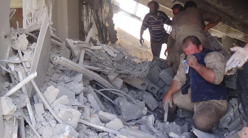 This image taken in Wednesday, Sept. 30, 2015 posted on the Twitter account of Syria Civil Defence, also known as the White Helmets, a volunteer search and rescue group, shows the aftermath of an airstrike in Talbiseh, Syria. Russia on Wednesday carried out its first airstrikes in Syria in what President Vladimir Putin called a pre-emptive strike against the militants. Khaled Khoja, head of the Syrian National Council opposition group, said at the U.N. that Russian airstrikes in four areas, including Talbiseh, killed dozens of civilians, with children among the dead. (Syria Civil Defence via AP)